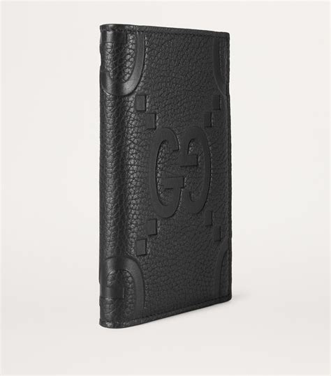 Jumbo GG passport case in Black Leather .